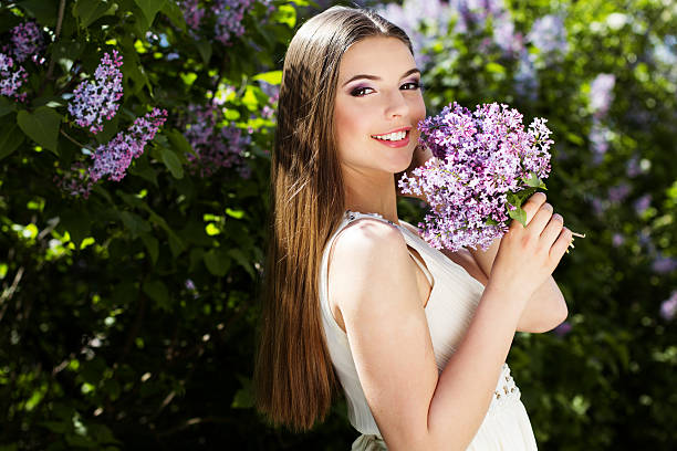 istock Beautiful girl with a lilac flowers 534368657