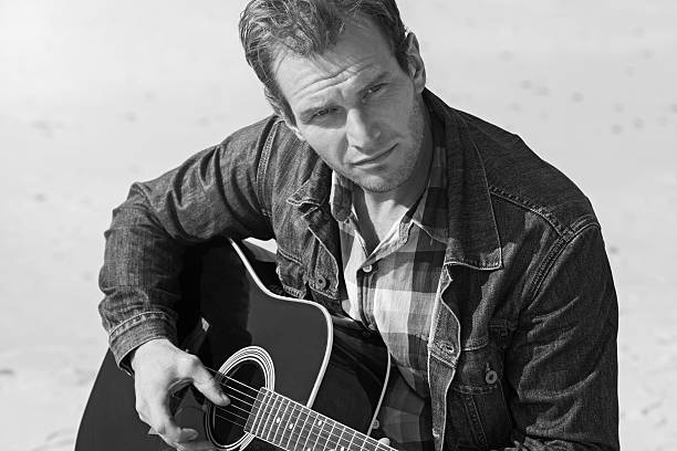 istock Man with acoustic guitar 534369059