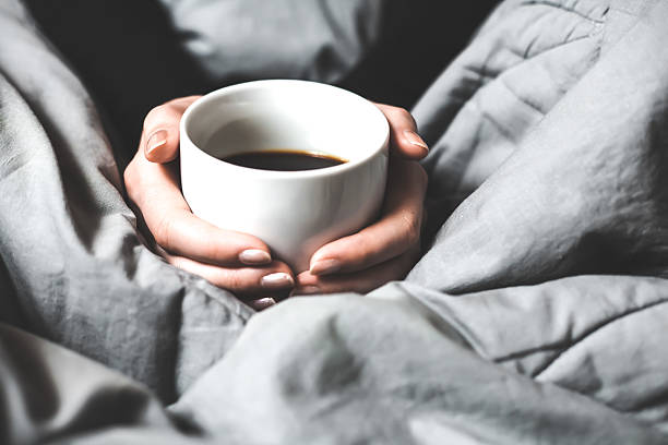 istock Woman holding a cup of coffee 534369211