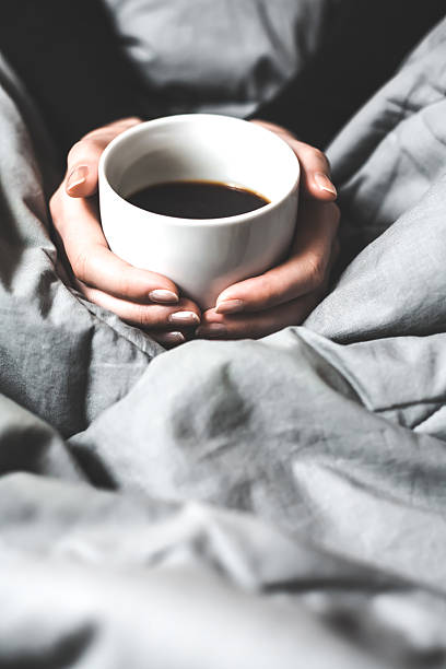 istock Woman holding a cup of coffee 534369221