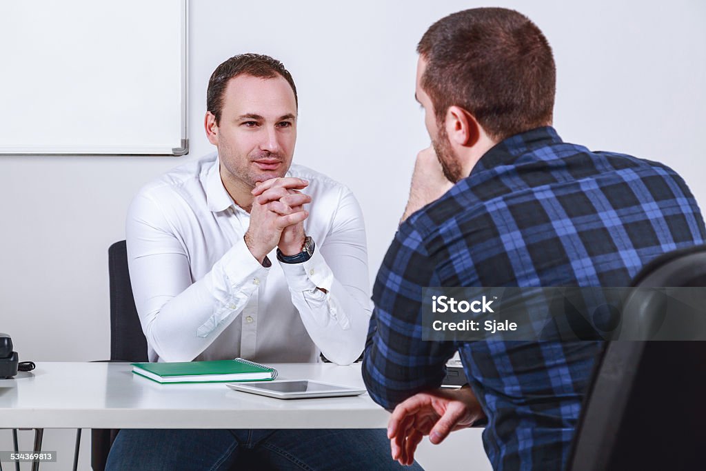 Man in job interview Man in office at job interview Blue-collar Worker Stock Photo