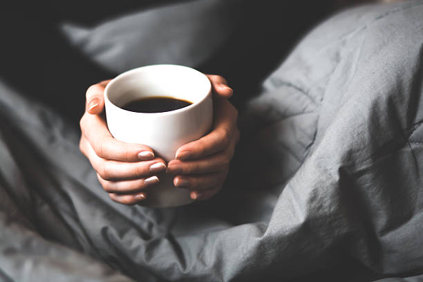 istock Woman holding a cup of coffee 534369879