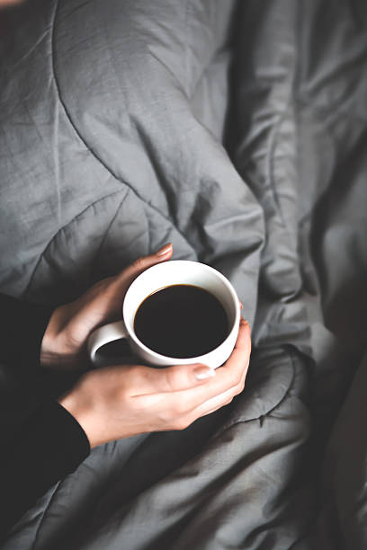 istock Woman holding a cup of coffee 534369887