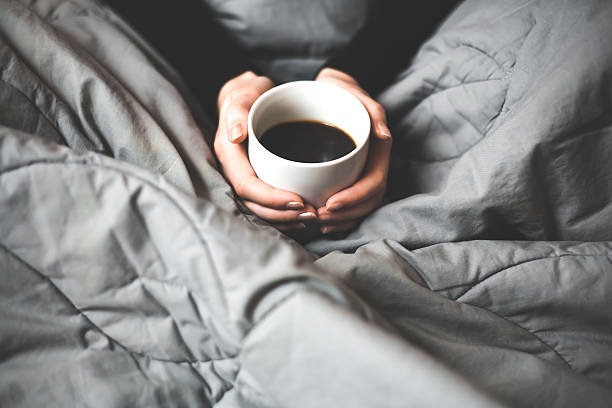 istock Woman holding a cup of coffee 534369893