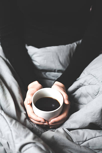 istock Woman holding a cup of coffee 534369897
