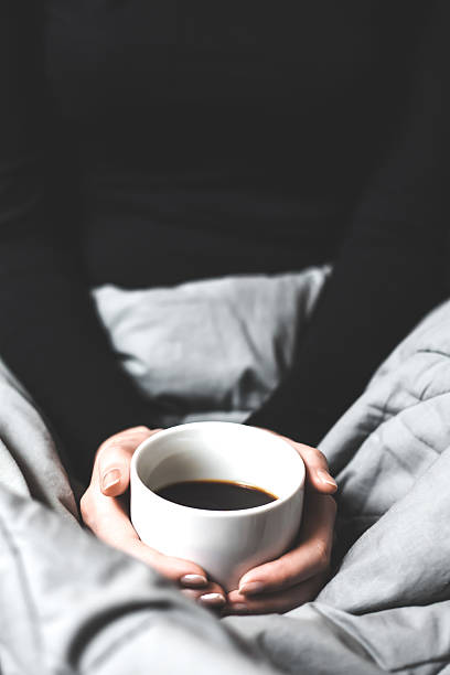 istock Woman holding a cup of coffee 534369901