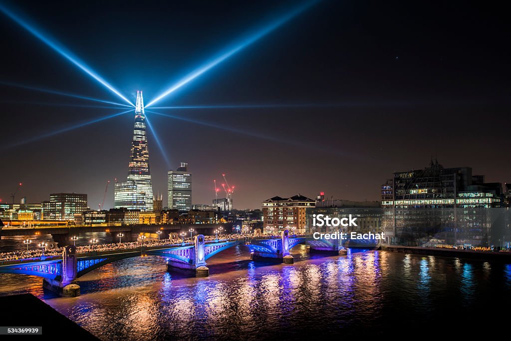 View of Southwark bridge and the Shard at night Colorful view of Southwark bridge and the Shard Tower at night during new year's eve, as seen from the north bank of the Thames river London - England Stock Photo