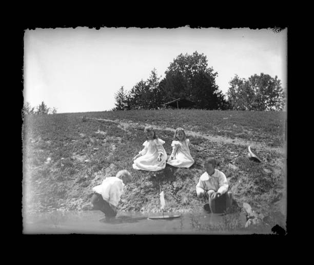 istock Victorian-era Children Playing with a Toy Boat 534370735