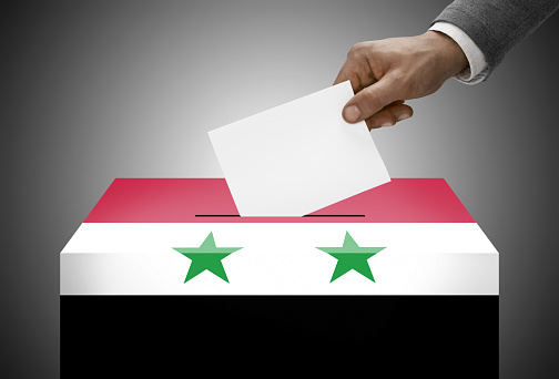 Ballot box painted into national flag colors - Syria