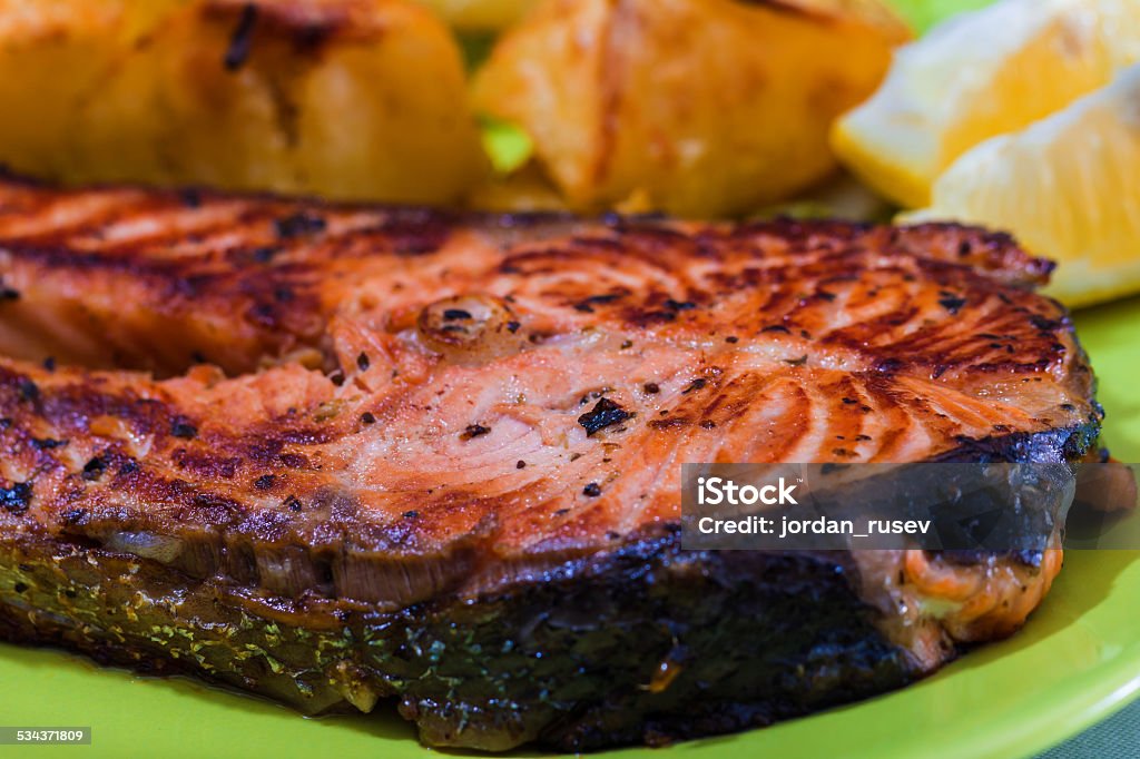 Grilled Salmon Fish meat Grilled Salmon with Fresh Salad Leaf and potatoes 2015 Stock Photo