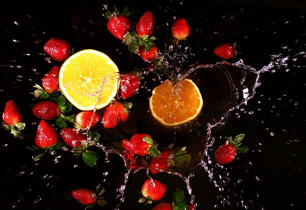 istock splashing water - Strawberries and Orange 534372697
