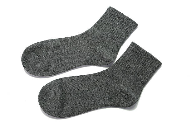 istock Pair of gray socks on white background 534385610