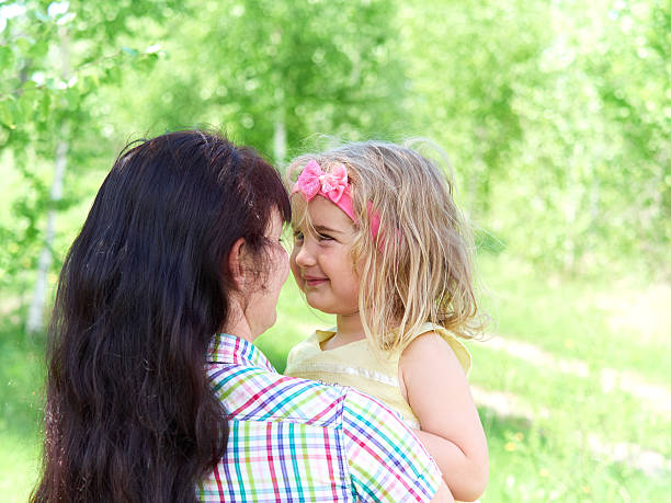istock mother playing with her  little daughter on nature 534396338