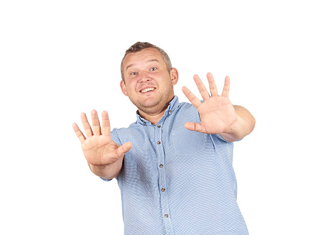 istock Fat man looking shocked scared trying to protect himself 534397748