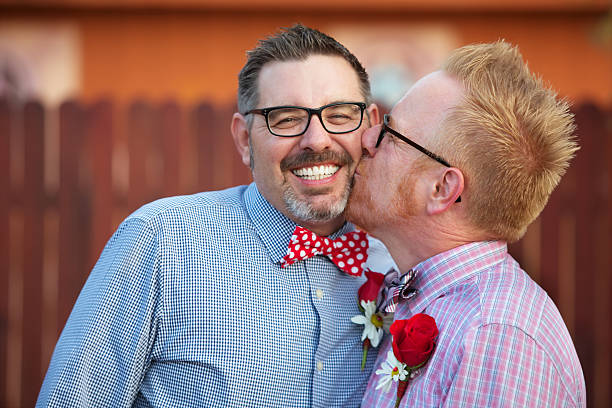 istock Smiling Man Kissed By Spouse 534398096