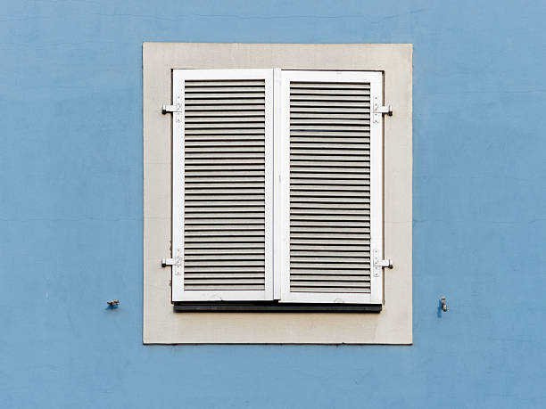 istock Window with white wooden shutter and blue wall in Franconia 534402246