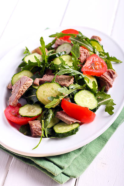 istock Beef, cucumber, tomato and rocket salad 534404620