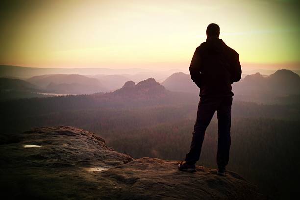 istock Silhouette of Youngl Man with Hands on Hips, Late Day 534405368