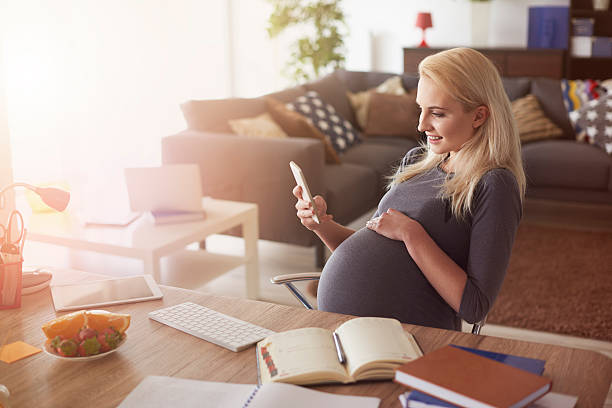 Cheerful future mom and her business