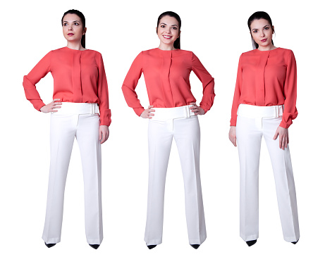 Portrait of happy businesswoman wearing white pants and coral shirt