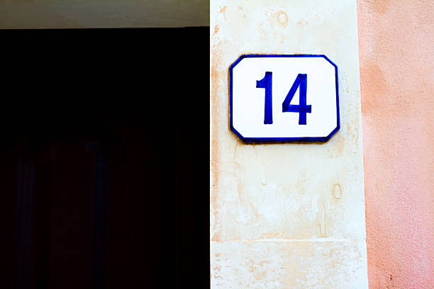 istock Number 14 Street Address Tile On White-Pink Wall 534406546