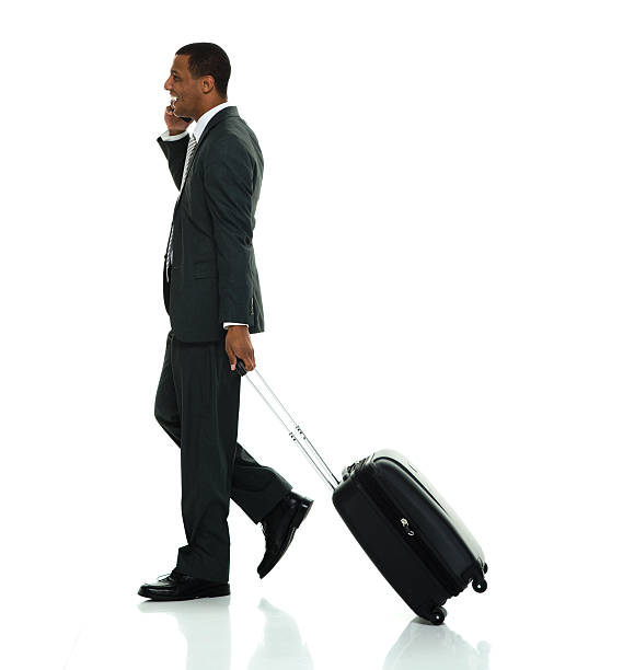 istock Smiling businessman on phone and walking 534406866