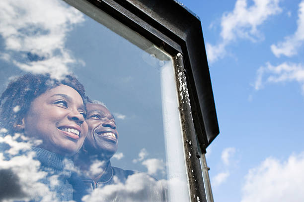 istock Couple looking out of a window 534417661