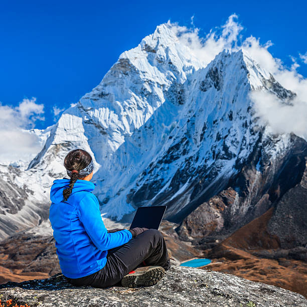 istock Woman is using laptop in Mount Everest National Park, Nepal 534417663