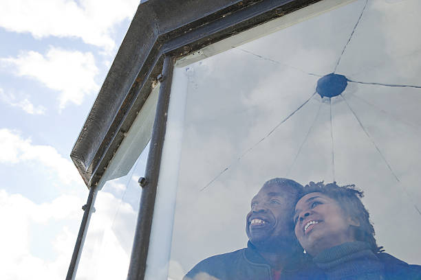 istock Couple looking out of a window 534417671