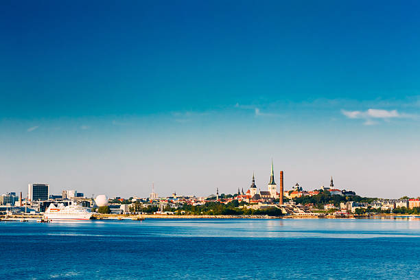Skyline Of Tallinn And Harbour, Coast With Blue Clear Sky At Sunrise, Estonia. View From Sea, Gulf Of Finland
