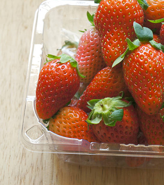 istock close up of fresh strawberries in plastic pack 534419429