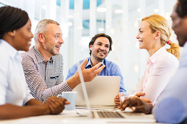 istock Happy business people on a meeting. 534420125