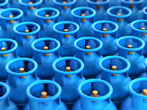 Blue gas cylinders stack with depth of field effect.