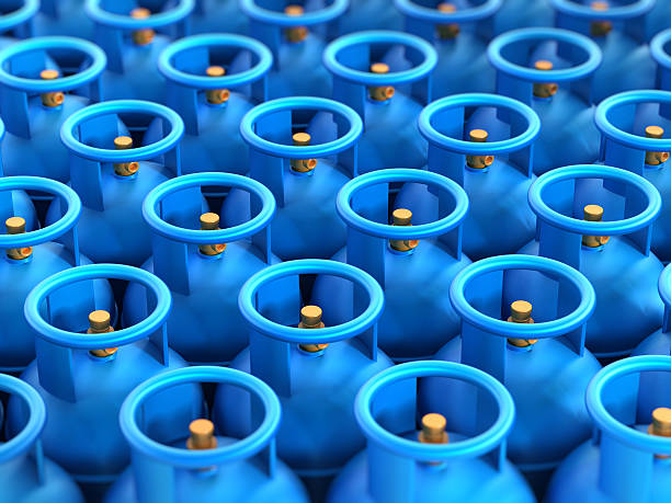 Gas cylinders stack Blue gas cylinders stack with depth of field effect. propane photos stock pictures, royalty-free photos & images
