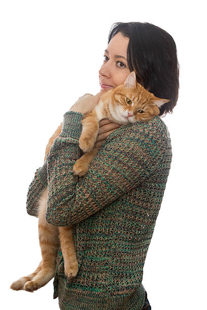 istock Woman and orange cat 534421285