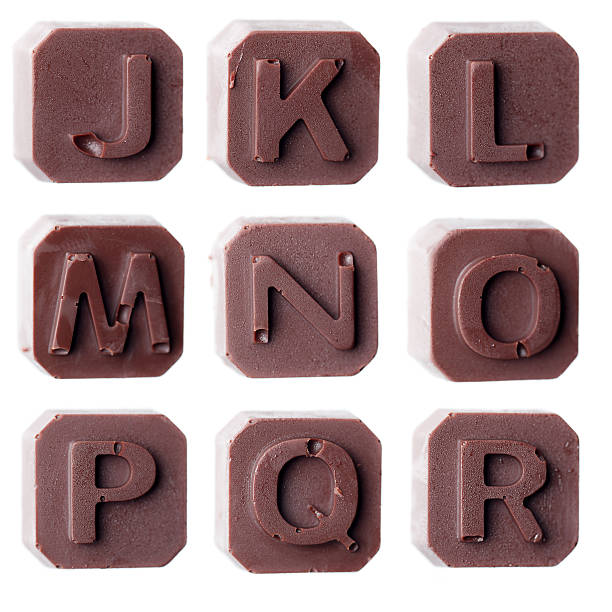 istock Real dark chocolate alphabet isolated on a white background 534423599