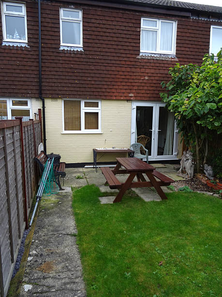 istock Typical 1980s terraced house, rendering / exterior wall tiles cladding, back-garden 534424077