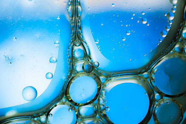 istock Oil drops on a water surface,blue background 534426175