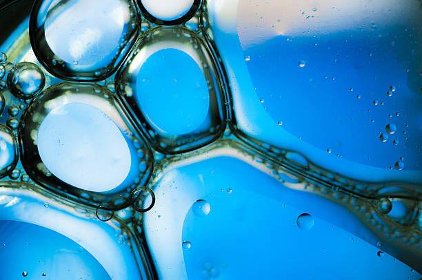 istock Oil drops on a water surface,blue background 534426197