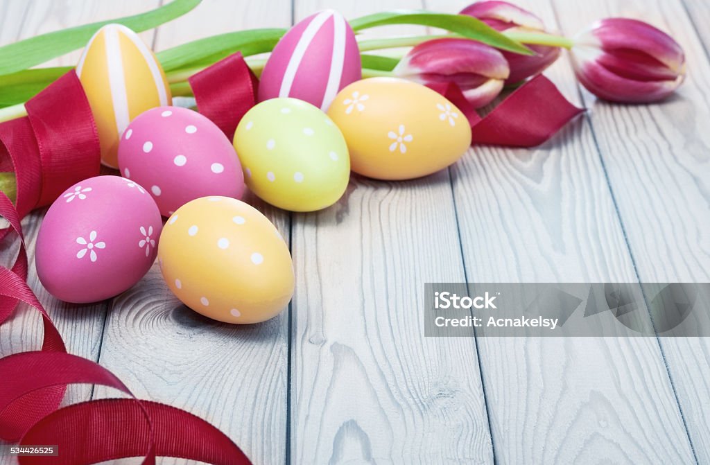 colorful easter eggs and ribbon on wooden background 2015 Stock Photo