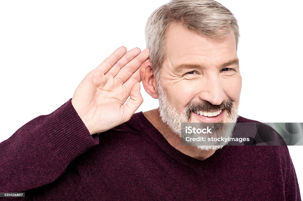 What you said, can't hear you ! Mature man cupping hand behind ear Ear Stock Photo