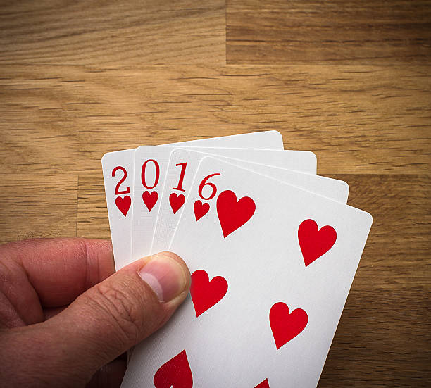 istock Playing card 2016 with heart on wood 534459952