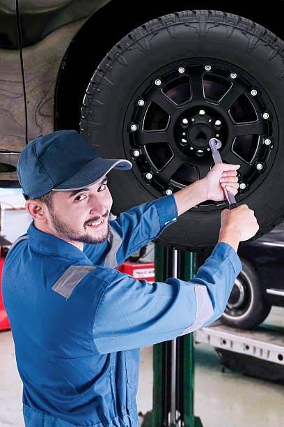 istock Arabic mechanic replacing a car wheel 534460480