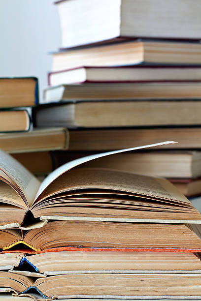 istock stacks of old opened books, closeup view 534460520