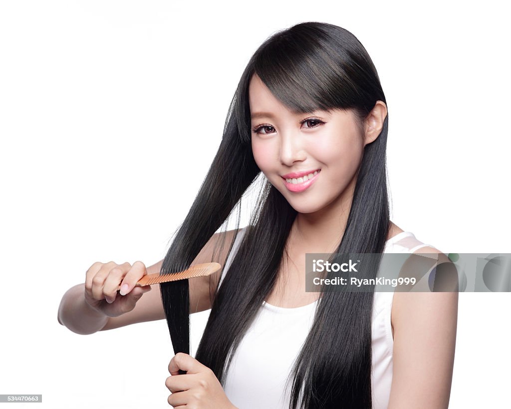 Woman with health hair care Beautiful Woman touch her health long straight hair care with smile face, asian beauty model 2015 Stock Photo