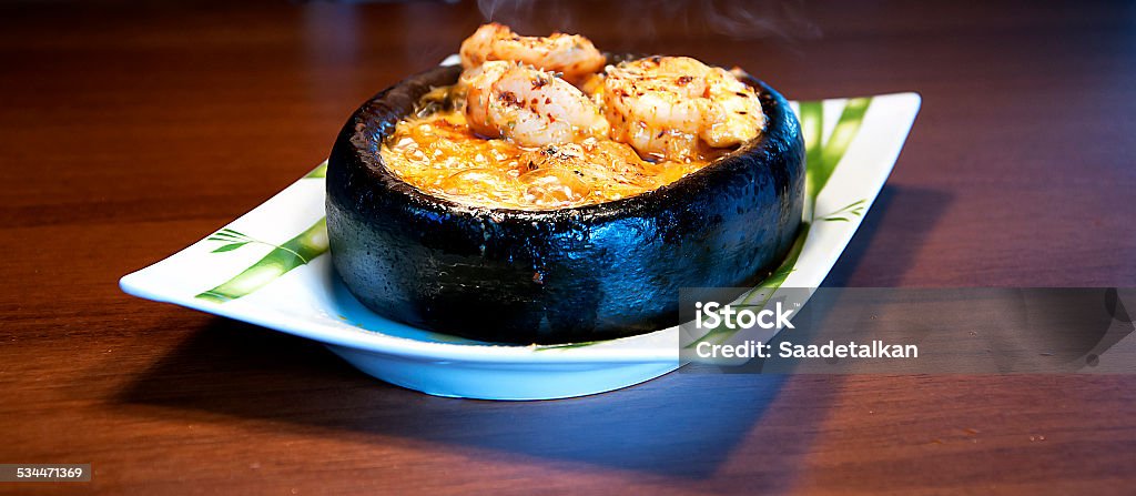 Prepared Shrimp Prepared shrimp in a casserole is now removed from the oven. 2015 Stock Photo