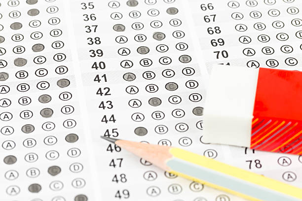 istock Filled answer sheet with eraser and pencil 534471871