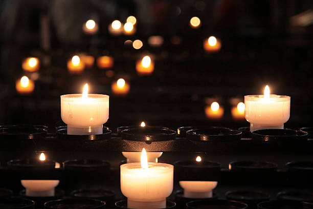 istock Blazing candle-flames in church 534474651