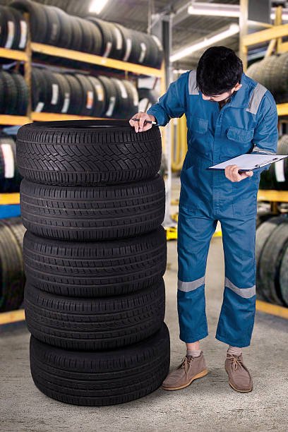 istock Arabic mechanic checks the tires in workshop 534476196