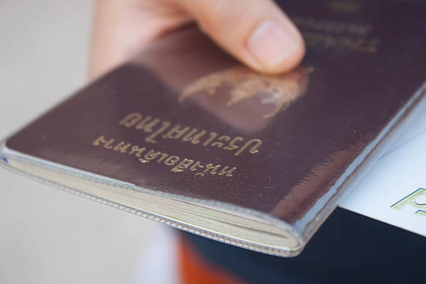 istock Thailand passport in hand women 534476317
